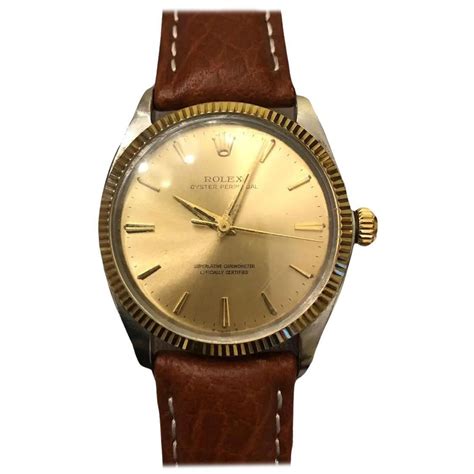 rolex oyster perpetual gold fluted bazel leather
